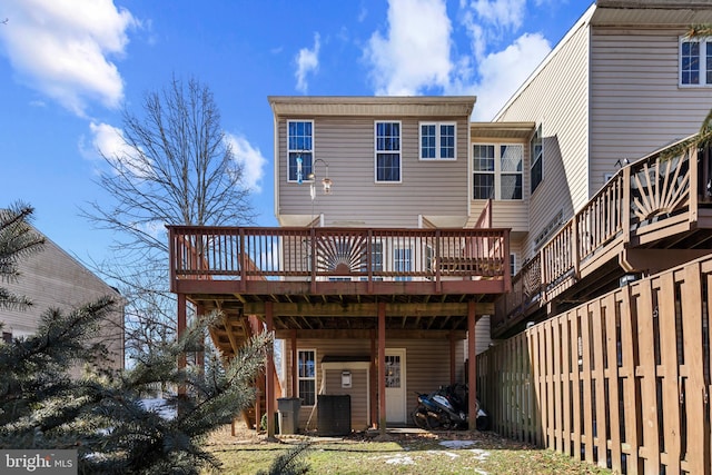 back of property with a wooden deck