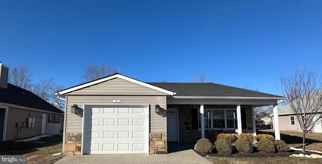 ranch-style home with a garage and covered porch