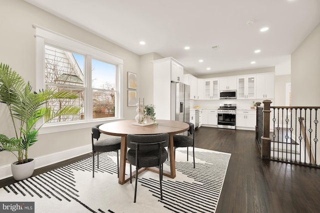 dining area with dark wood-type flooring