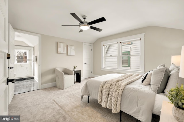 carpeted bedroom with ceiling fan and lofted ceiling