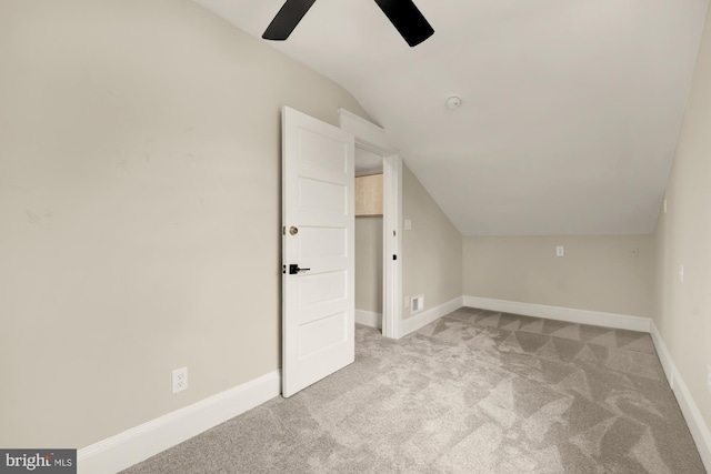 bonus room with light carpet, vaulted ceiling, and ceiling fan