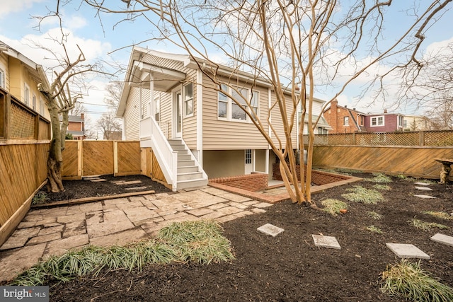 rear view of property featuring a patio area