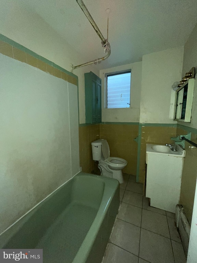 full bathroom featuring tile walls, tile patterned floors, toilet, and shower / washtub combination