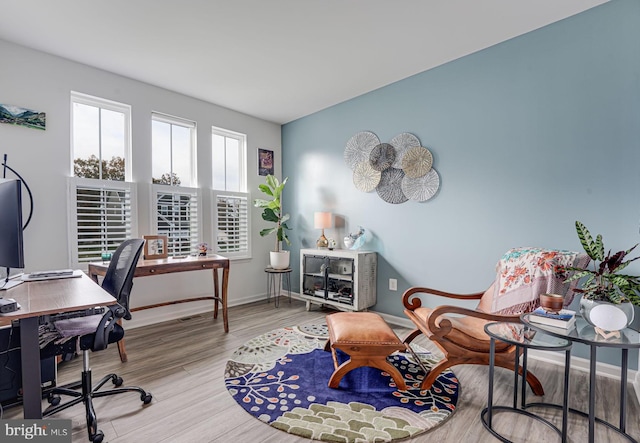 home office with light wood-type flooring