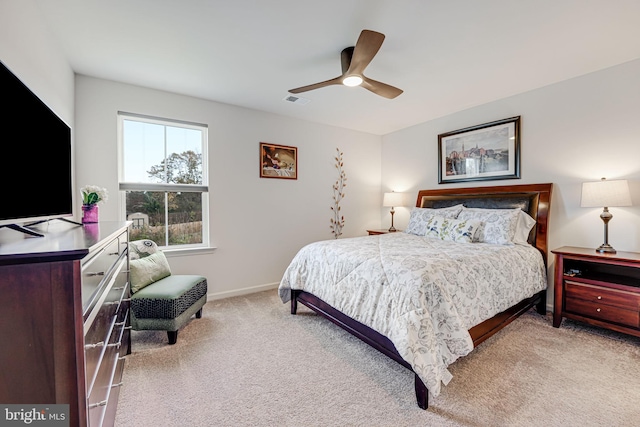 bedroom with light colored carpet and ceiling fan