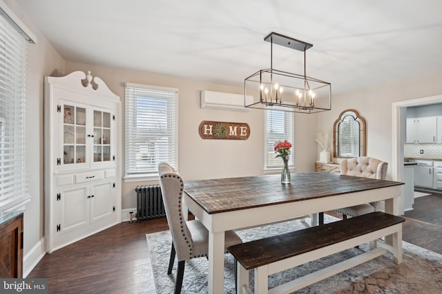 dining area featuring dark hardwood / wood-style flooring, radiator heating unit, an AC wall unit, and plenty of natural light