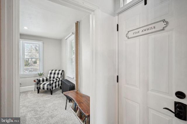 mudroom featuring carpet and radiator heating unit