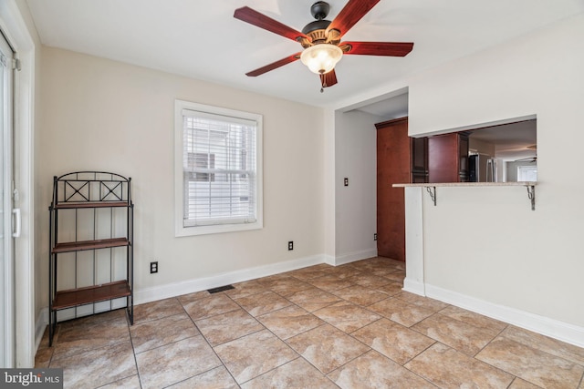 spare room featuring ceiling fan