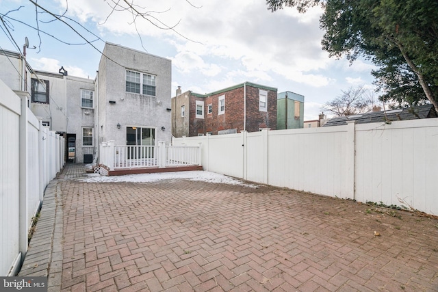 back of property with a patio area