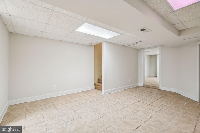 basement featuring a paneled ceiling