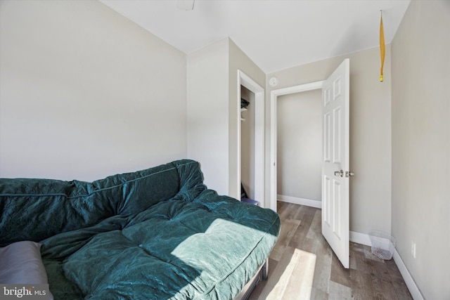 bedroom with hardwood / wood-style flooring