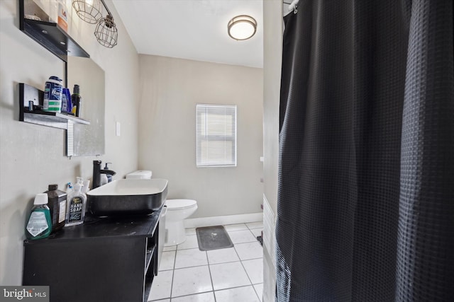 bathroom with tile patterned flooring, vanity, curtained shower, and toilet