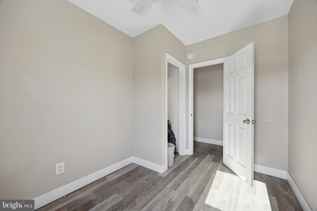 unfurnished bedroom featuring hardwood / wood-style flooring and ceiling fan