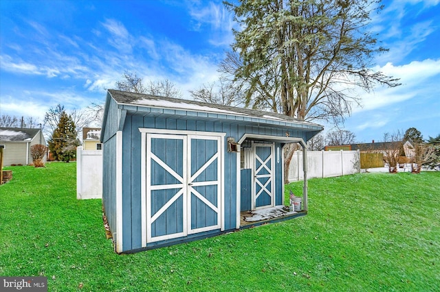 view of outdoor structure with a lawn