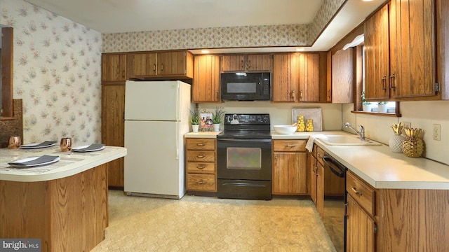 kitchen with sink and black appliances