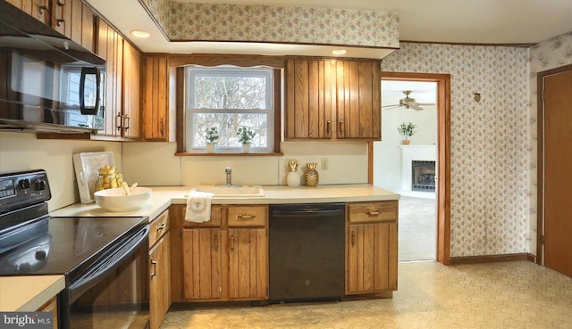 kitchen featuring ornamental molding, sink, ceiling fan, and black appliances