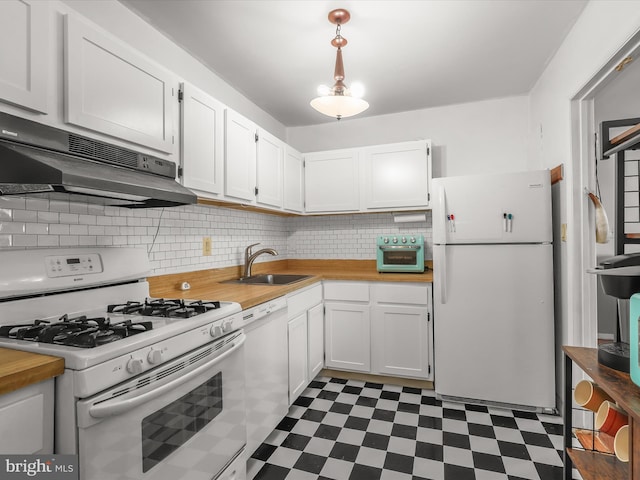 kitchen with sink, pendant lighting, white appliances, decorative backsplash, and white cabinets