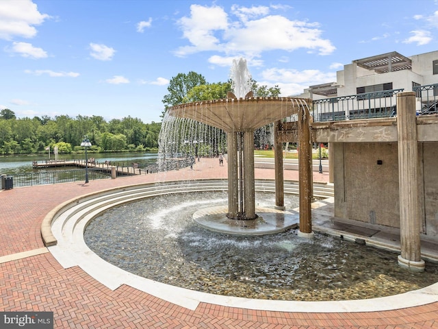 view of home's community with a water view