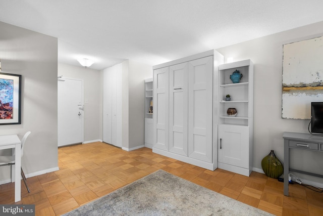 entryway with light parquet floors