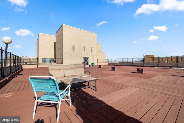 wooden terrace featuring outdoor lounge area