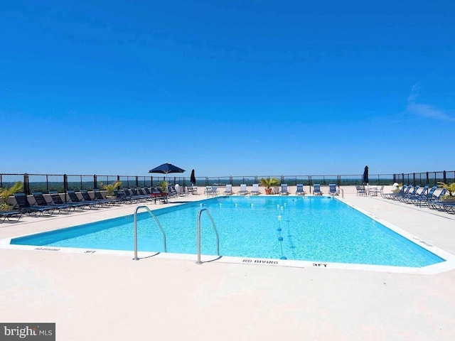 view of swimming pool featuring a patio