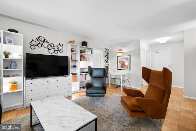 living room featuring light parquet flooring