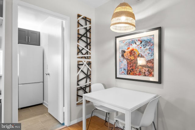 dining space featuring light hardwood / wood-style floors