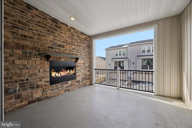 view of patio / terrace with an outdoor brick fireplace