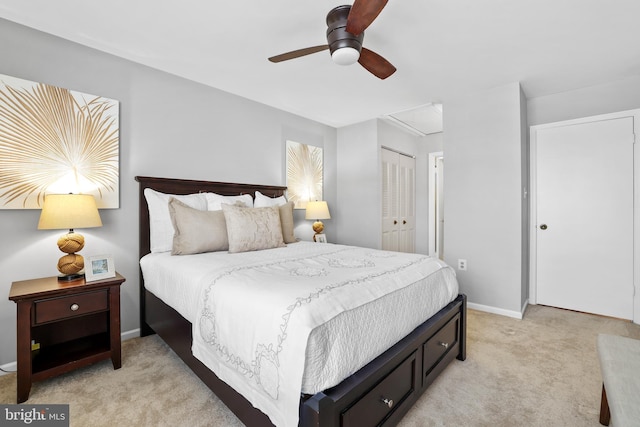 bedroom featuring light carpet, a closet, and ceiling fan