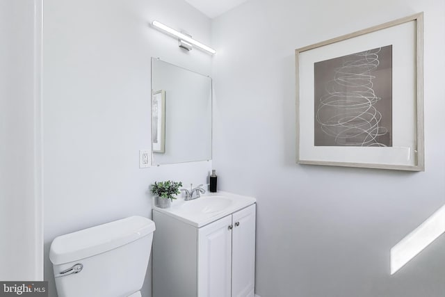 bathroom with toilet and vanity