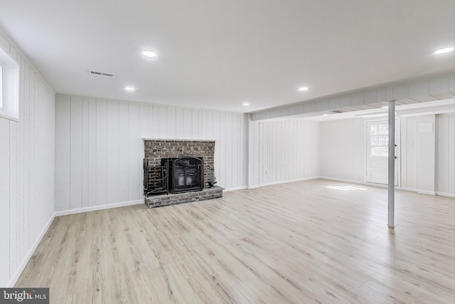 basement featuring visible vents, recessed lighting, baseboards, and wood finished floors