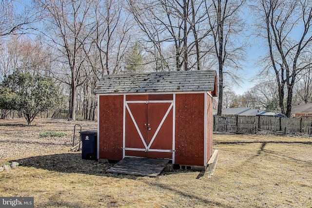 view of shed with fence