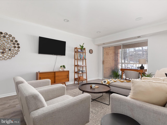 living room featuring wood-type flooring and crown molding