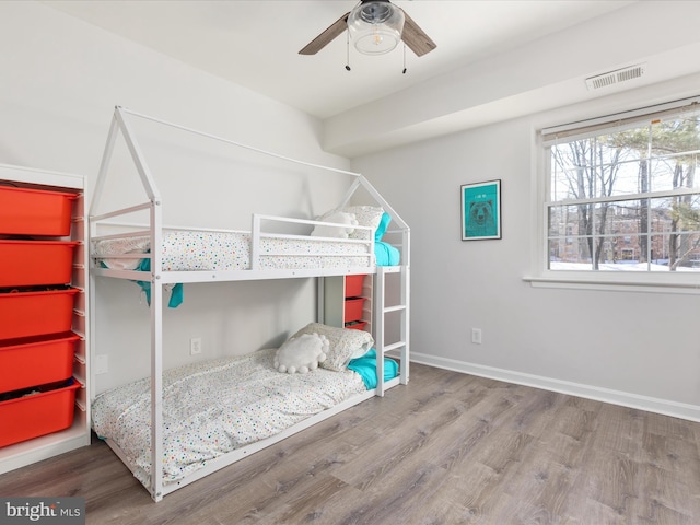 bedroom featuring ceiling fan and hardwood / wood-style floors