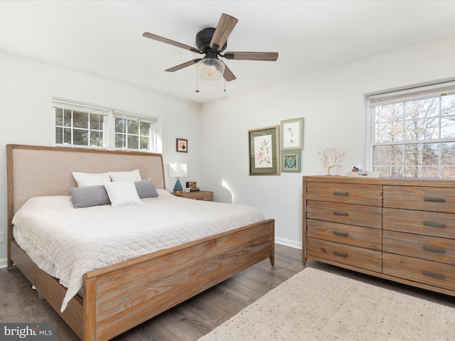 bedroom featuring dark hardwood / wood-style floors and ceiling fan