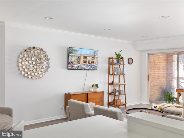 living room with hardwood / wood-style flooring and ornamental molding