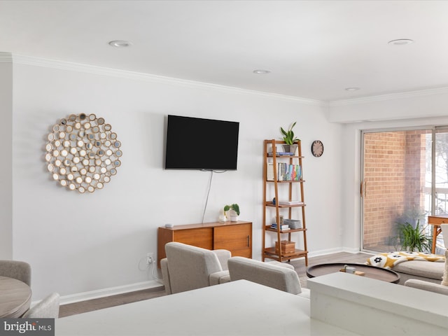 living room with wood-type flooring and crown molding