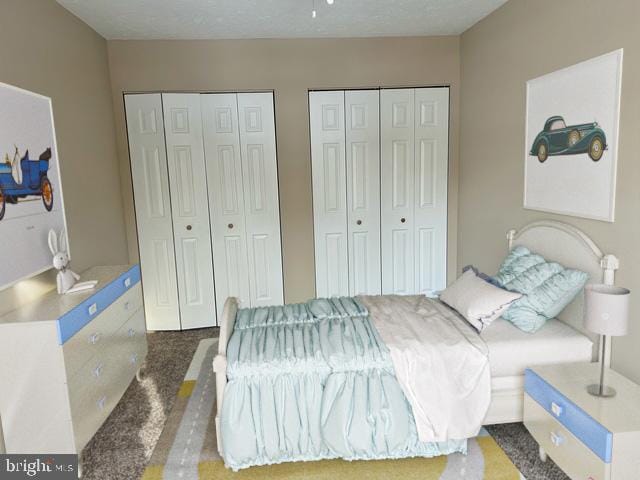 carpeted bedroom featuring two closets