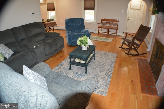 living room with hardwood / wood-style flooring and baseboard heating