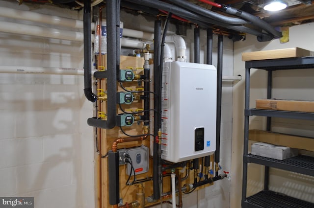 utility room featuring water heater