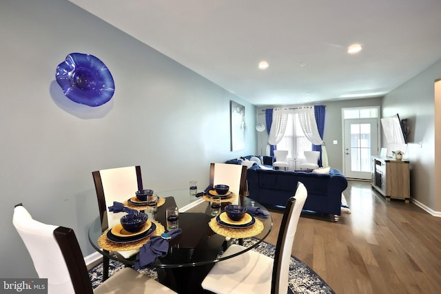 dining space featuring hardwood / wood-style flooring