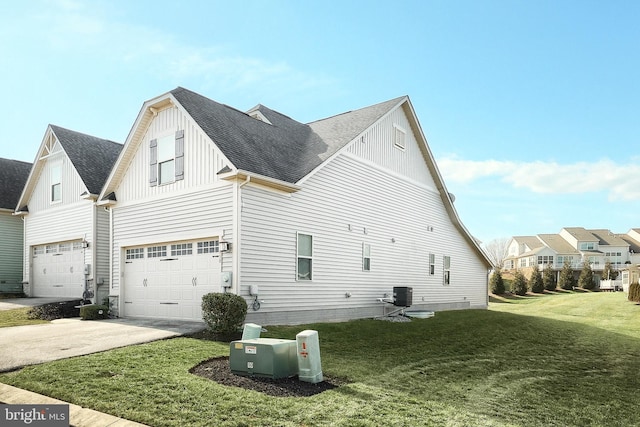 view of property exterior featuring cooling unit, a garage, and a yard