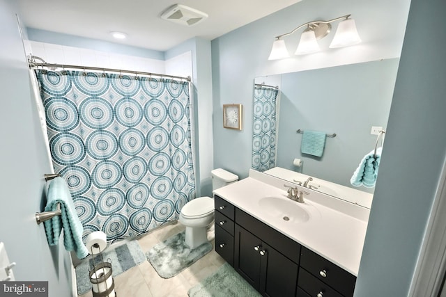 bathroom featuring vanity, toilet, and a shower with shower curtain