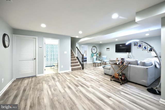 living room with light hardwood / wood-style flooring