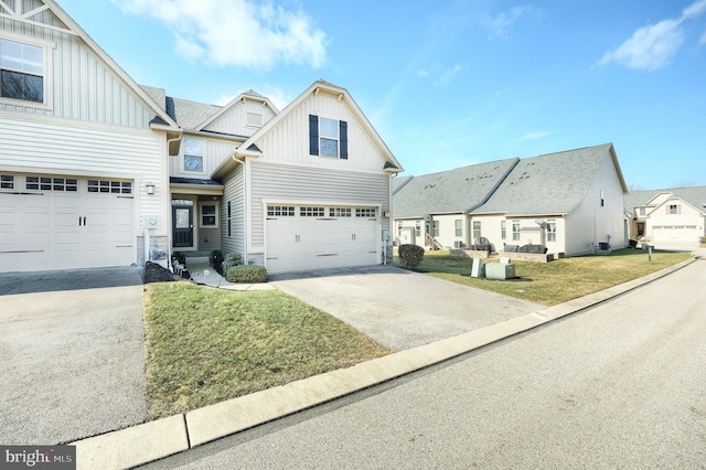 view of front of property with a garage and a front lawn