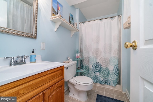 bathroom with vanity, a shower with shower curtain, tile patterned floors, and toilet