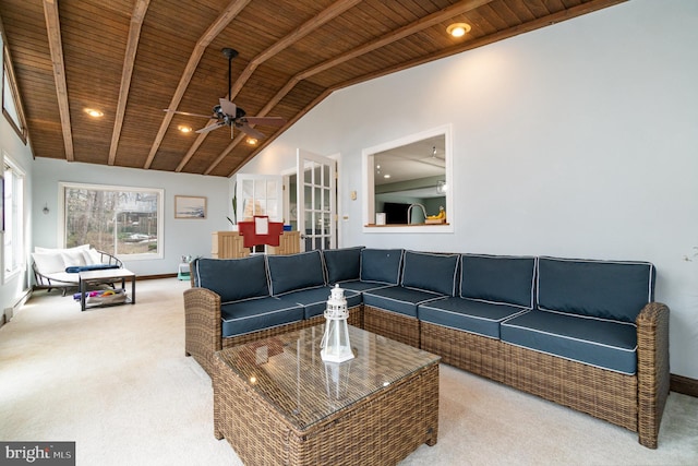 carpeted living room with ceiling fan, high vaulted ceiling, wooden ceiling, and beamed ceiling