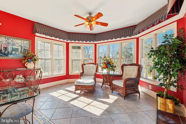 sunroom featuring ceiling fan