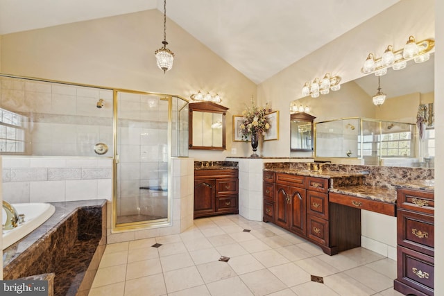 bathroom with lofted ceiling, vanity, independent shower and bath, and tile walls