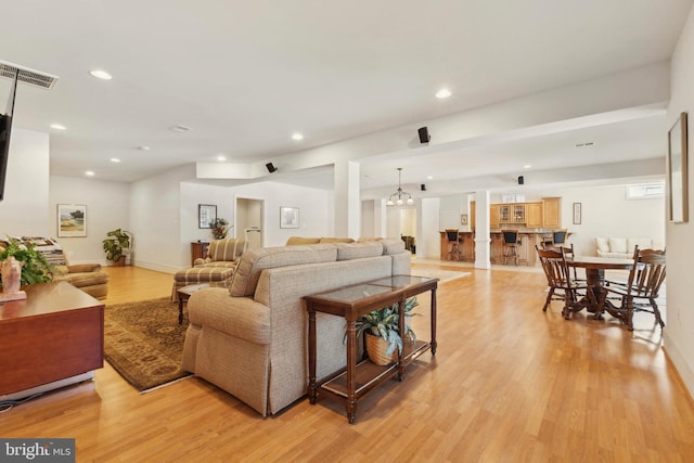 living room with light hardwood / wood-style flooring